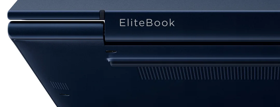Macro detail of an EliteBook lid hinge and machined edge catching studio light